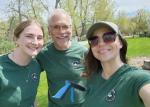 A group of people wearing green shirts